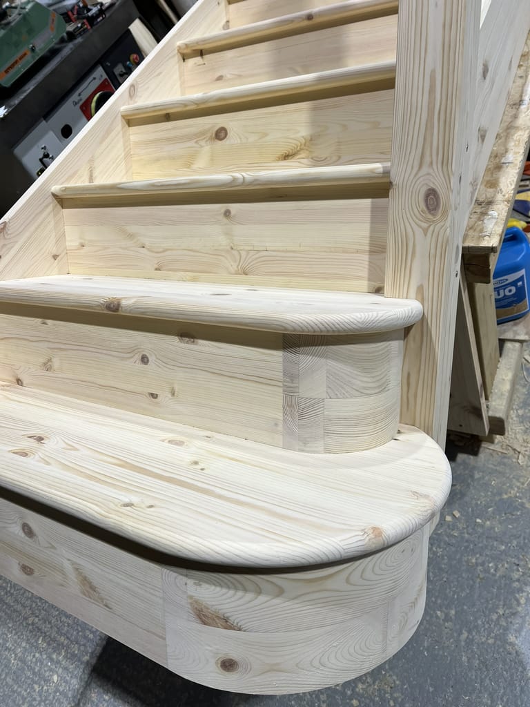 Close-up of handcrafted wooden staircase steps