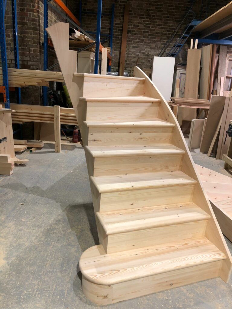 Softwood cut curved string staircase