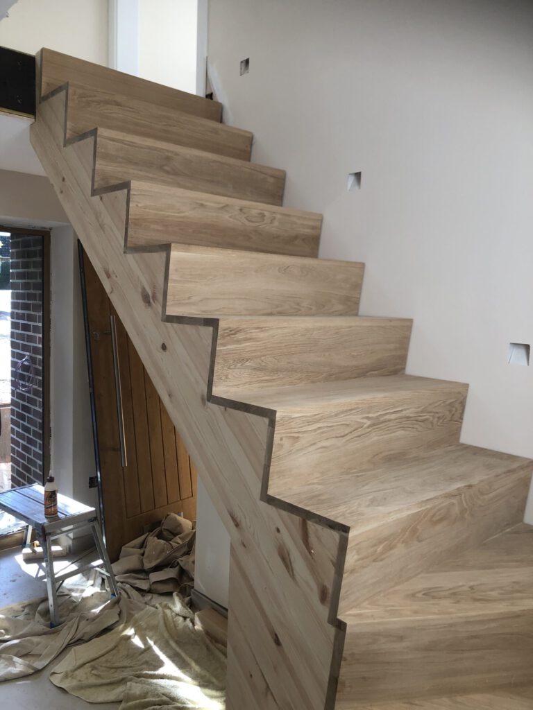Oak tread cut string staircase